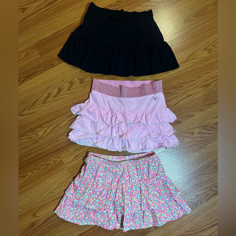 Girls 2 Justice skorts and 1 Circo skort - L/10 EUC